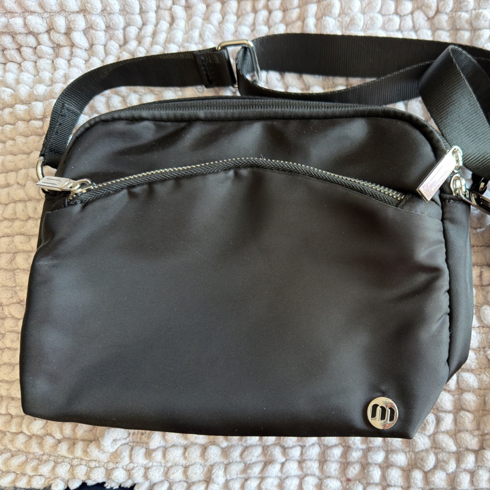 Black Crossbody Bag with Silver Accents. Great for travel.